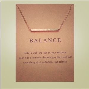 Balance necklace with a card